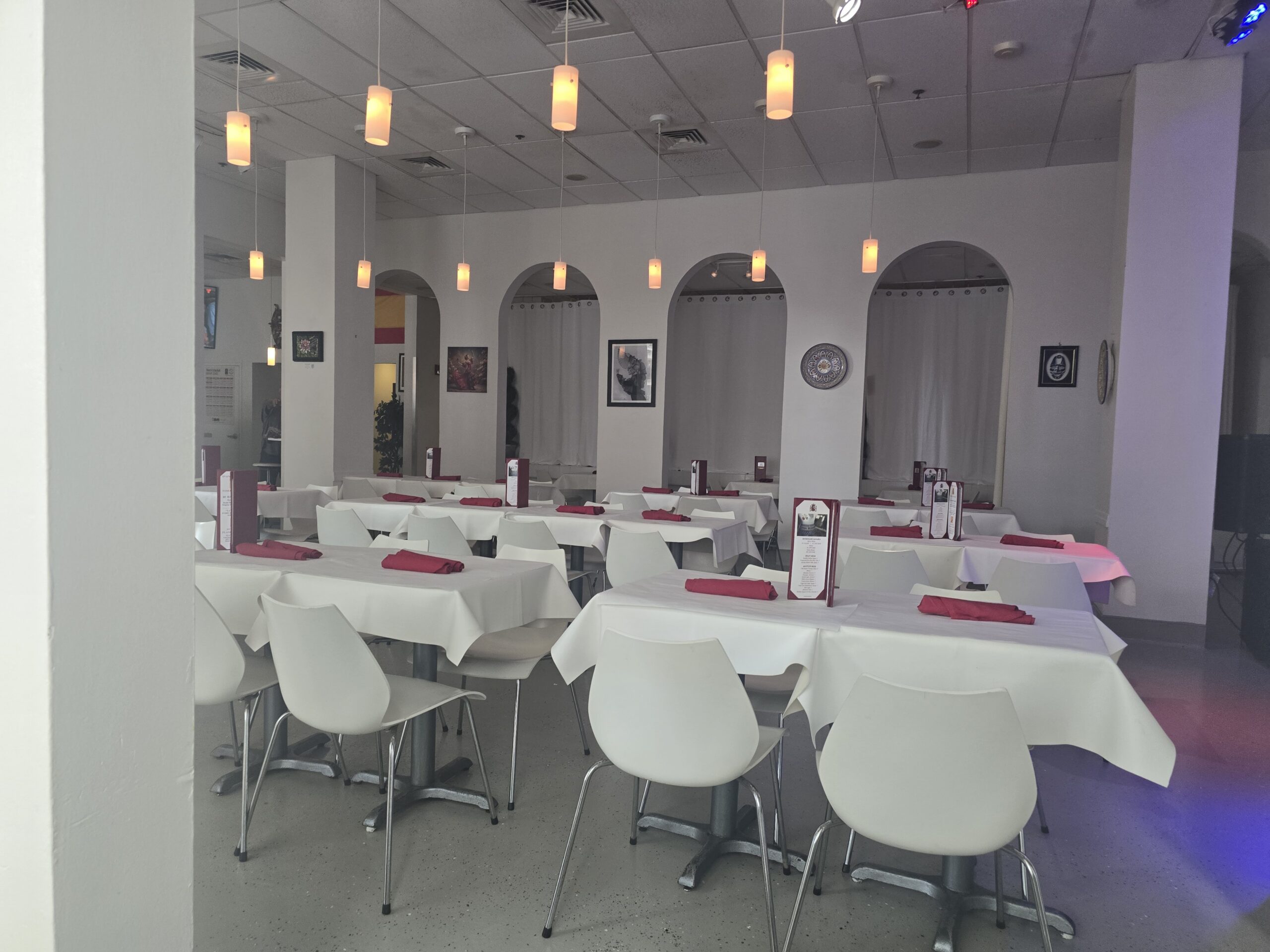 Spain Restaurant — White Tables and Pendant Lights