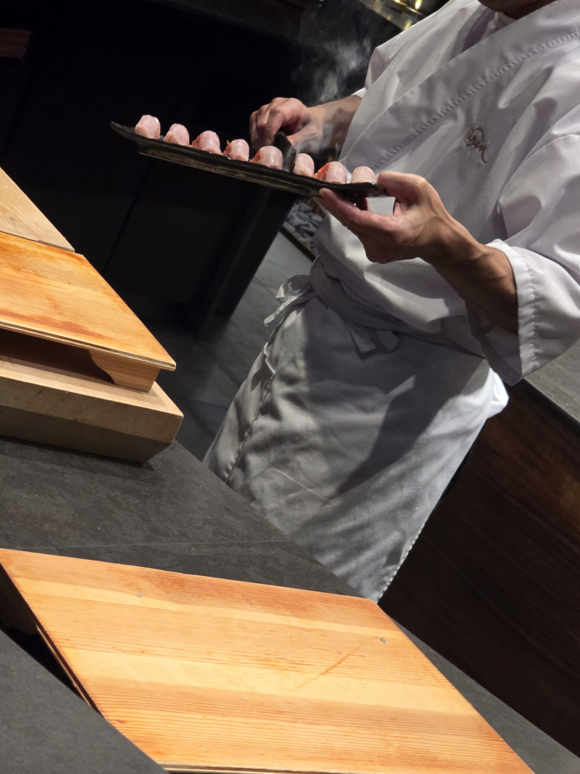 Searing the Amadai with a hot blade